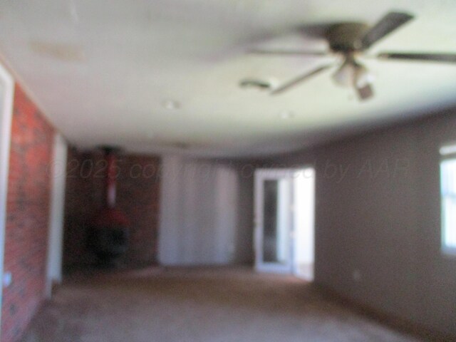 1502 Lancelot St, Borger, TX 79007 - unfurnished living room featuring a ceiling fan
