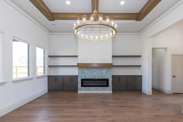 unfurnished living room featuring recessed lighting, wood finished floors, and a notable chandelier