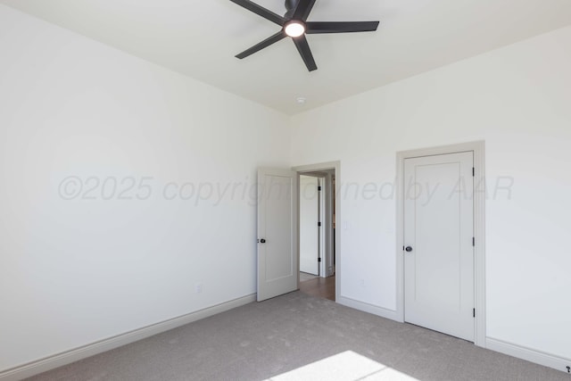 unfurnished bedroom with ceiling fan, baseboards, and carpet