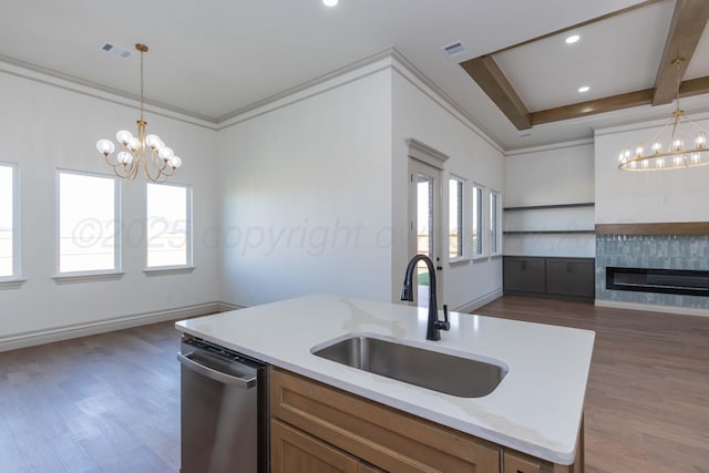 kitchen with dishwasher, dark wood finished floors, and a notable chandelier