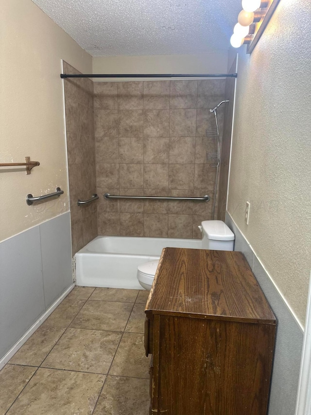 full bathroom featuring a textured ceiling, tile patterned flooring, toilet, a textured wall, and tub / shower combination