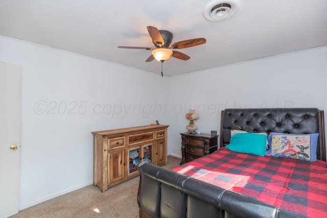 bedroom with carpet floors, visible vents, ceiling fan, and baseboards