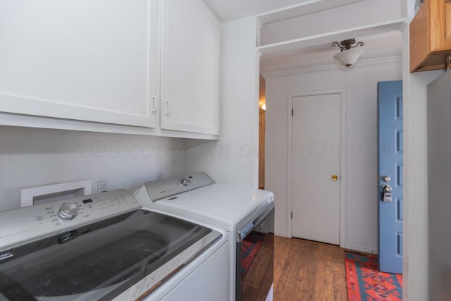 washroom featuring cabinet space, dark wood finished floors, and separate washer and dryer