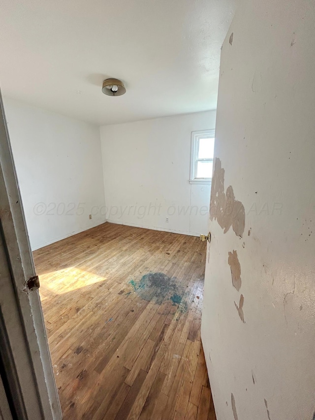 empty room featuring hardwood / wood-style flooring