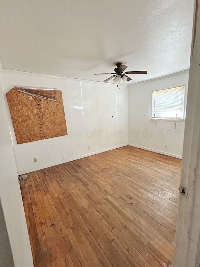 unfurnished room featuring hardwood / wood-style flooring, a textured ceiling, and ceiling fan