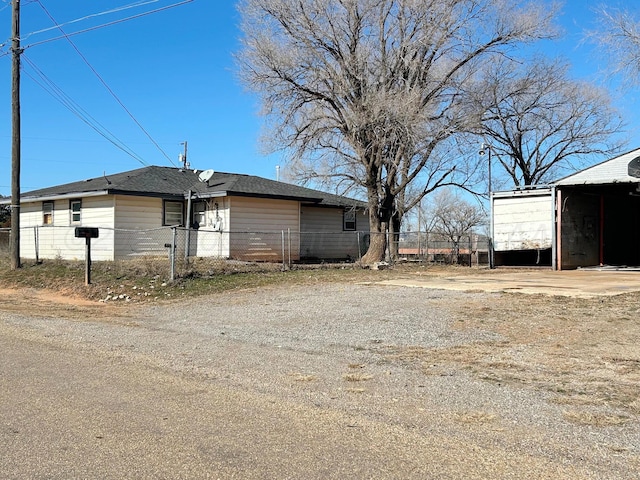 view of home's exterior with a carport