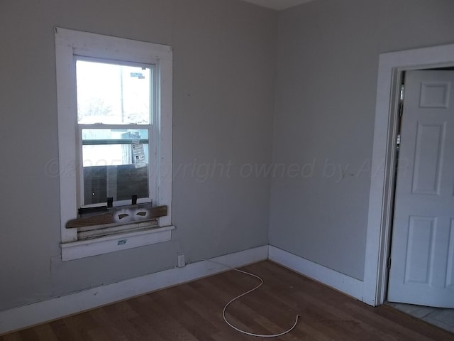 empty room featuring wood finished floors