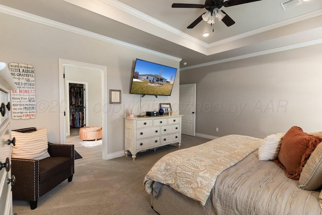 9111 Highland Springs Dr, Amarillo, TX 79119 - bedroom featuring a walk in closet, visible vents, baseboards, ornamental molding, and dark carpet