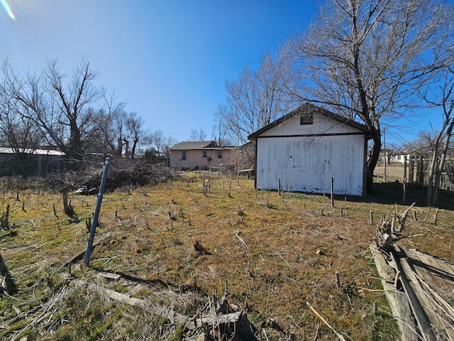 view of yard featuring an outbuilding and an outdoor structure