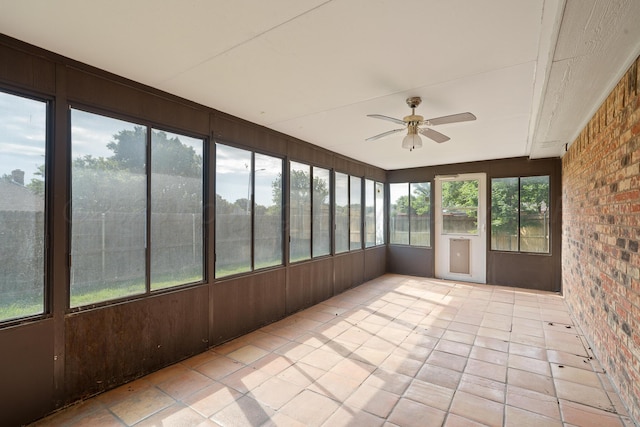6701 Admiral Ct, Amarillo, TX 79124 - unfurnished sunroom with brick wall and a ceiling fan