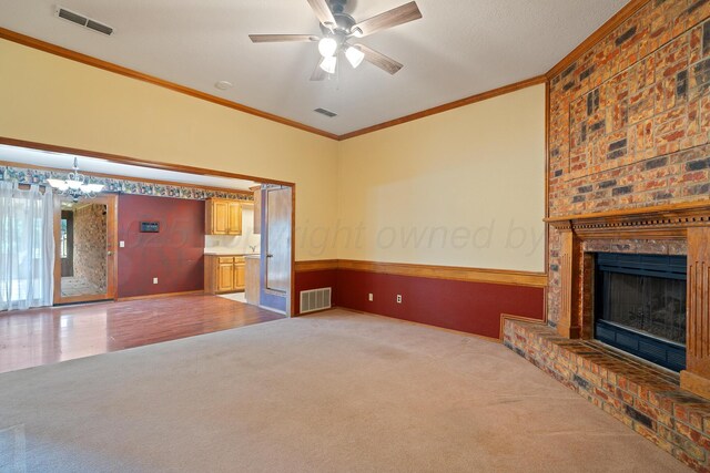 6701 Admiral Ct, Amarillo, TX 79124 - unfurnished living room featuring carpet, ornamental molding, a chandelier, ceiling fan, and a fireplace