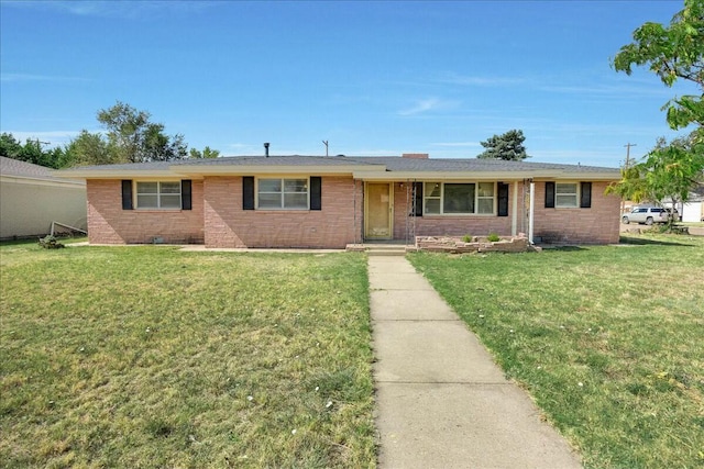 single story home featuring a front lawn