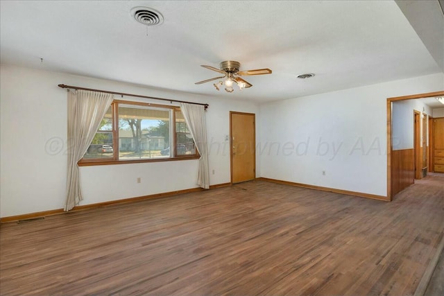 unfurnished room featuring ceiling fan and wood-type flooring