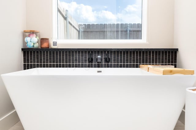 interior space with a soaking tub