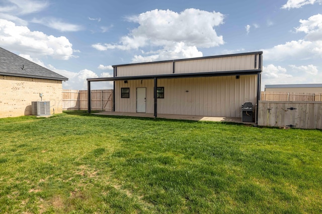 view of outbuilding featuring central AC unit and fence