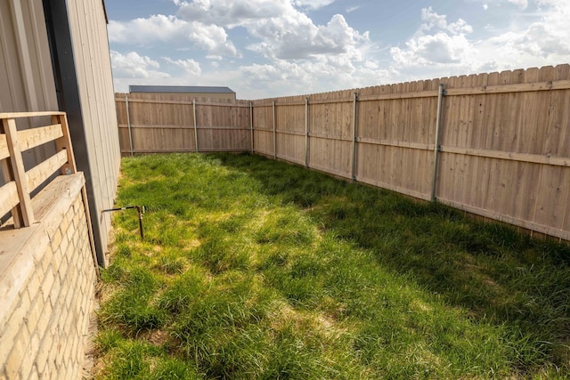 view of yard with a fenced backyard