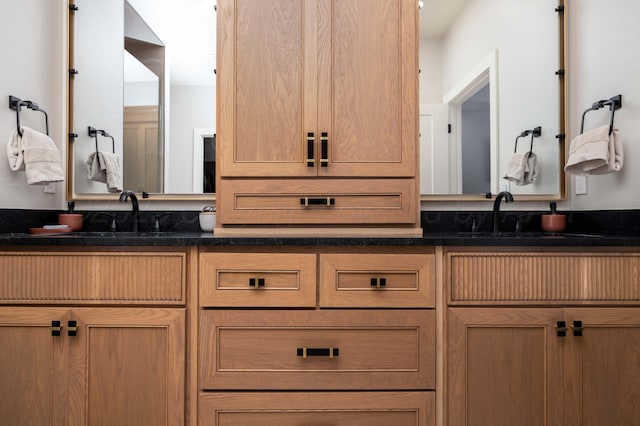 full bath featuring a sink and double vanity