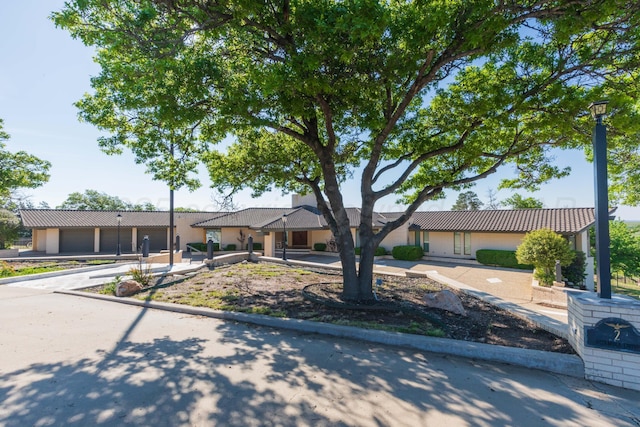 2 Altamira St, Borger, TX 79007 - view of front of home with a tiled roof and stucco siding