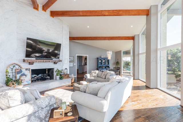 2 Altamira St, Borger, TX 79007 - living area featuring wood finished floors, healthy amount of natural light, and a stone fireplace