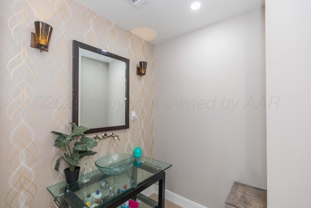 2 Altamira St, Borger, TX 79007 - corridor with wallpapered walls, baseboards, a sink, and recessed lighting