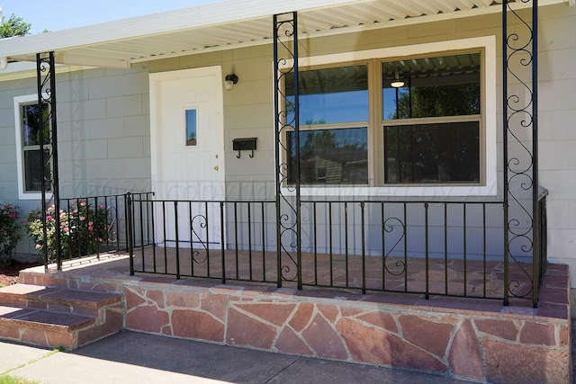 property entrance featuring covered porch