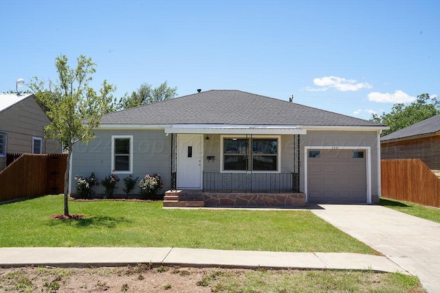 single story home with a porch, a garage, and a front lawn