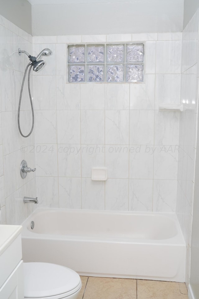 709 N Wells St, Pampa, TX 79065 - full bathroom featuring vanity, toilet, tiled shower / bath combo, and tile patterned flooring