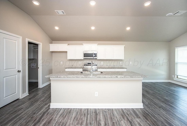 7200 Athens St, Amarillo, TX 79118 - kitchen with stainless steel appliances, lofted ceiling, an island with sink, dark wood finished floors, and white cabinetry
