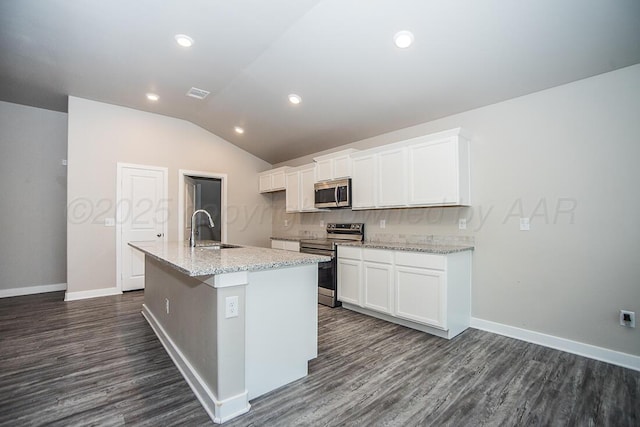 7200 Athens St, Amarillo, TX 79118 - kitchen featuring stainless steel appliances, an island with sink, dark wood finished floors, white cabinets, and lofted ceiling