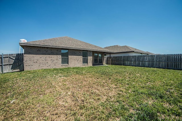 7200 Athens St, Amarillo, TX 79118 - back of house with a fenced backyard and brick siding