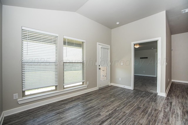 7200 Athens St, Amarillo, TX 79118 - empty room featuring dark wood-type flooring and vaulted ceiling