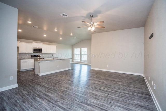 7200 Athens St, Amarillo, TX 79118 - kitchen featuring appliances with stainless steel finishes, open floor plan, a ceiling fan, dark wood-style floors, and lofted ceiling