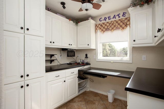 103 N Timbercreek Dr, Amarillo, TX 79118 - kitchen with white cabinets, dark countertops, and a ceiling fan