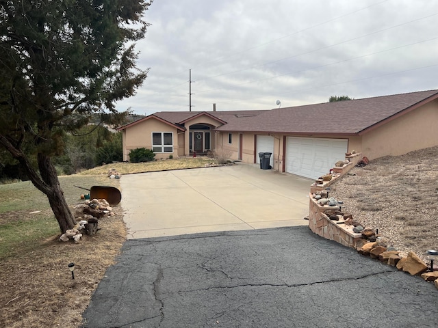 103 N Timbercreek Dr, Amarillo, TX 79118 - ranch-style home featuring concrete driveway, an attached garage, roof with shingles, and stucco siding
