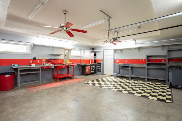 103 N Timbercreek Dr, Amarillo, TX 79118 - garage with a workshop area, a ceiling fan, and a garage door opener