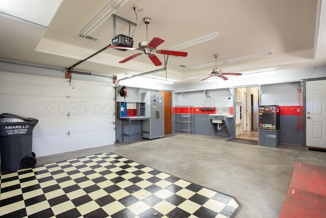 103 N Timbercreek Dr, Amarillo, TX 79118 - garage featuring a garage door opener, a ceiling fan, and visible vents