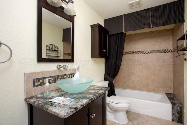 103 N Timbercreek Dr, Amarillo, TX 79118 - bathroom featuring toilet, visible vents, shower / tub combo, tile patterned flooring, and vanity
