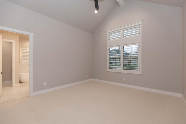 spare room featuring baseboards, vaulted ceiling with beams, light carpet, and a ceiling fan