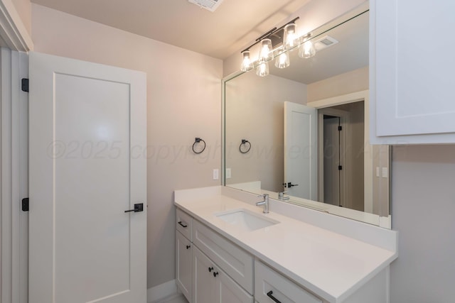 bathroom with visible vents and vanity