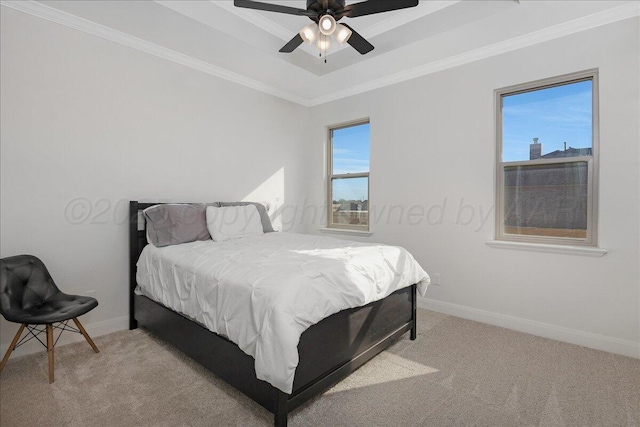 carpeted bedroom featuring ceiling fan and ornamental molding