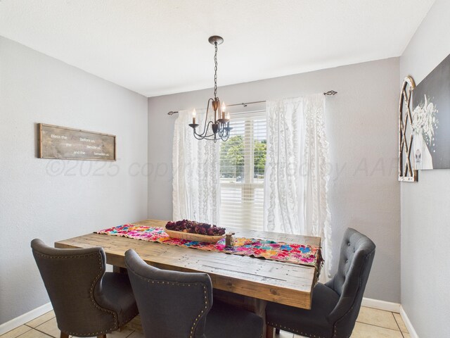1409 Bailey Ave, Dumas, TX 79029 - dining space with a chandelier and light tile patterned floors