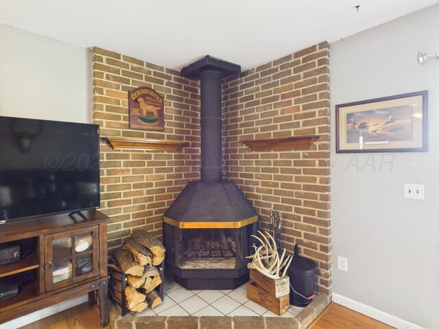 1409 Bailey Ave, Dumas, TX 79029 - detailed view of a wood stove and wood finished floors