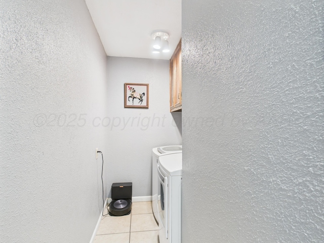 1409 Bailey Ave, Dumas, TX 79029 - washroom with light tile patterned floors, cabinet space, independent washer and dryer, and a textured wall