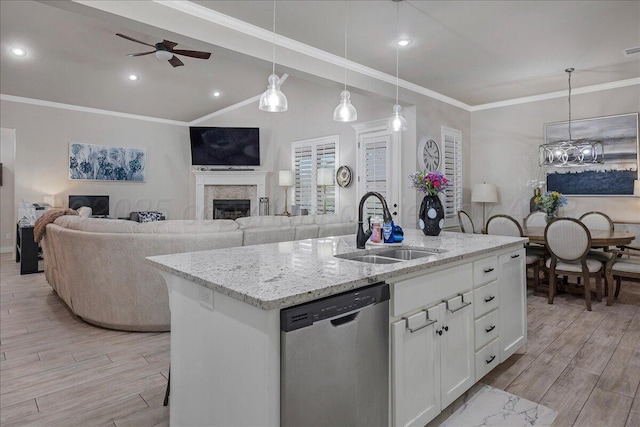 9109 Staten Island St, Amarillo, TX 79119 - kitchen featuring dishwasher, light wood-type flooring, a ceiling fan, white cabinetry, and ornamental molding