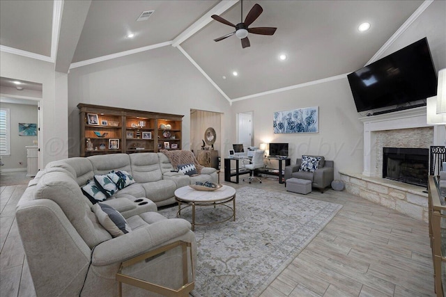 9109 Staten Island St, Amarillo, TX 79119 - living room with a ceiling fan, a stone fireplace, wood finished floors, high vaulted ceiling, and beam ceiling