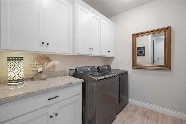 9109 Staten Island St, Amarillo, TX 79119 - washroom with cabinet space, washer and dryer, and light wood-style floors