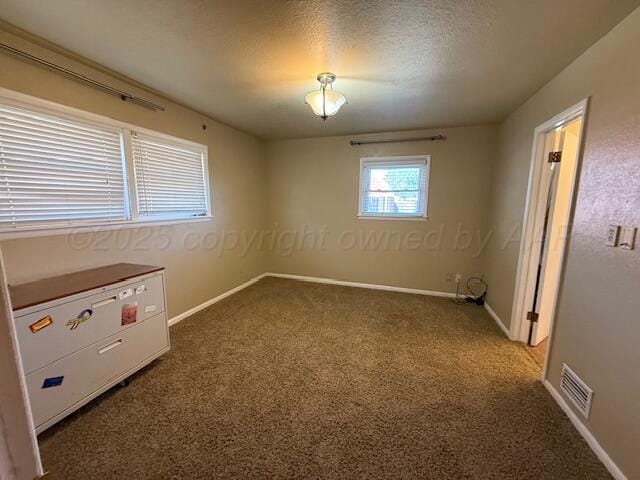 unfurnished bedroom with visible vents, baseboards, and carpet floors