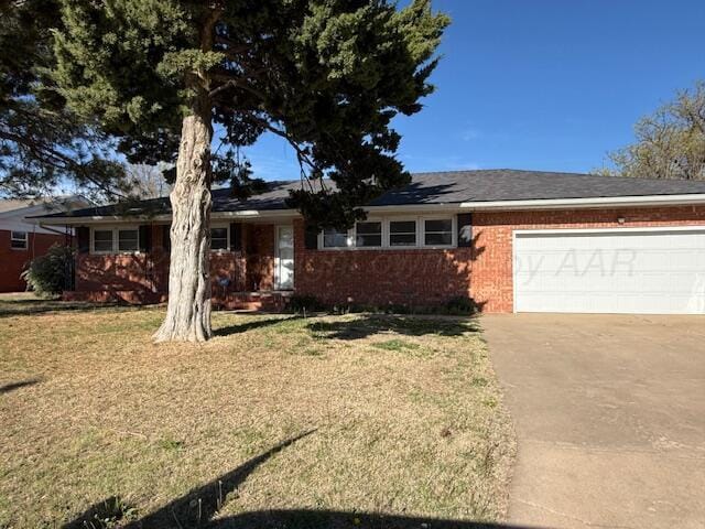 single story home featuring brick siding, driveway, a front lawn, and a garage