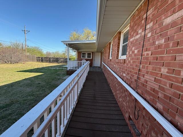 exterior space with a yard and fence