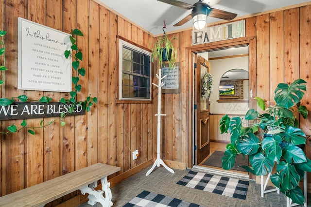 interior space with ceiling fan